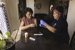 healthcare worker and patient at patient's home